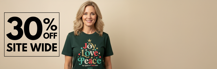 Woman wearing a green t-shirt with 'Joy Love Peace' design, standing next to a promotional banner for 30% off site wide.